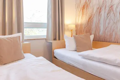 Ein Bett oder Betten in einem Zimmer der Unterkunft Residenz am Strand, Whg 677