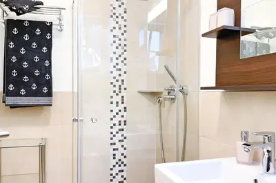 Ein Badezimmer in der Unterkunft Käptn ADI