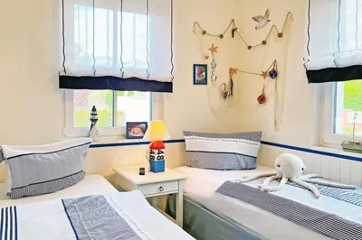 Ein Bett oder Betten in einem Zimmer der Unterkunft Käptn ADI