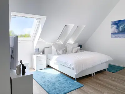 Ein Bett oder Betten in einem Zimmer der Unterkunft Tordalk 07