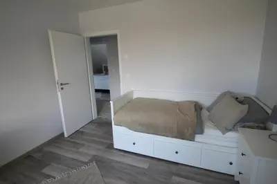 Ein Bett oder Betten in einem Zimmer der Unterkunft Bodden Perle