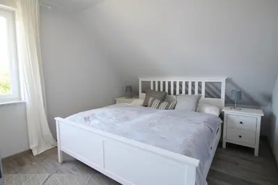 Ein Bett oder Betten in einem Zimmer der Unterkunft Bodden Perle