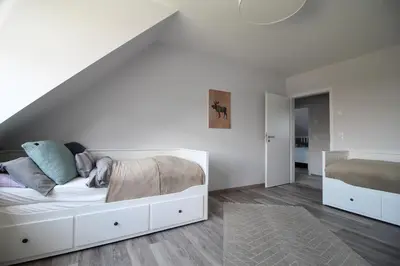 Ein Bett oder Betten in einem Zimmer der Unterkunft Bodden Perle