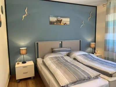 Ein Bett oder Betten in einem Zimmer der Unterkunft Friedenstraße 17 Whg 2