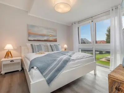 Ein Bett oder Betten in einem Zimmer der Unterkunft Ostseesegler