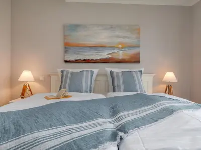 Ein Bett oder Betten in einem Zimmer der Unterkunft Ostseesegler