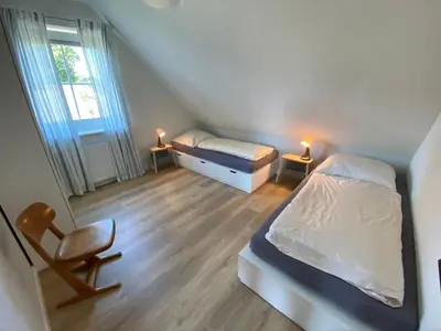 Ein Bett oder Betten in einem Zimmer der Unterkunft Hus Hygge