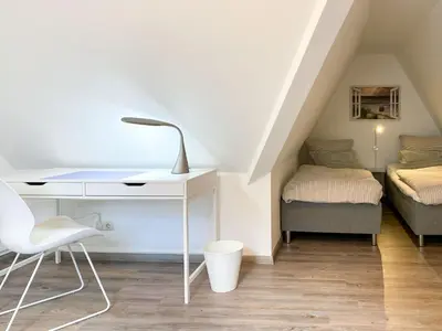 Ein Bett oder Betten in einem Zimmer der Unterkunft Kormoran 19