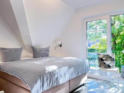 Ein Bett oder Betten in einem Zimmer der Unterkunft Kormoran 19