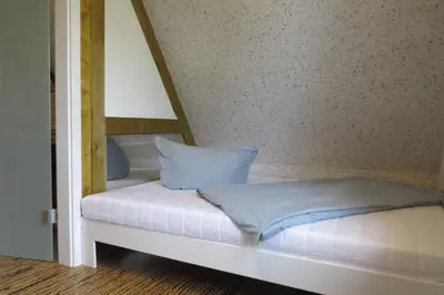 Ein Bett oder Betten in einem Zimmer der Unterkunft Ferienhaus Möve