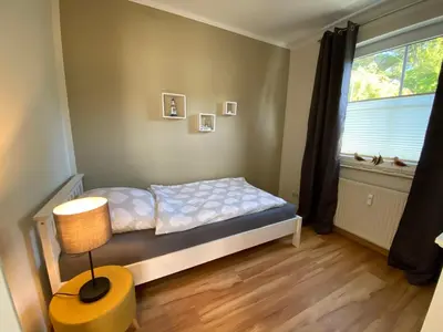 Ein Bett oder Betten in einem Zimmer der Unterkunft Meerzeit - a45022