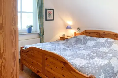 Ein Bett oder Betten in einem Zimmer der Unterkunft Windflüchter 1