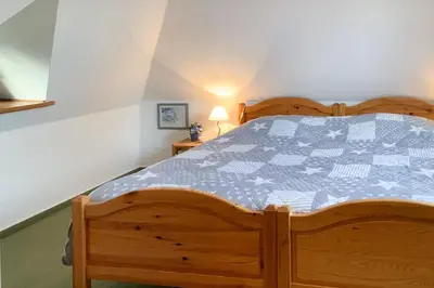 Ein Bett oder Betten in einem Zimmer der Unterkunft Windflüchter 1