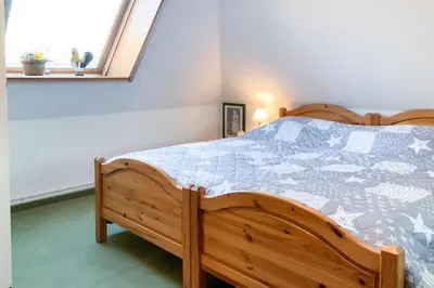 Ein Bett oder Betten in einem Zimmer der Unterkunft Windflüchter 2
