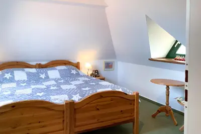 Ein Bett oder Betten in einem Zimmer der Unterkunft Windflüchter 2