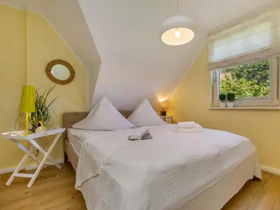Ein Bett oder Betten in einem Zimmer der Unterkunft Bernsteinsuite