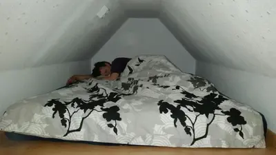 Ein Bett oder Betten in einem Zimmer der Unterkunft Ferienzimmer für Zwei am Strand