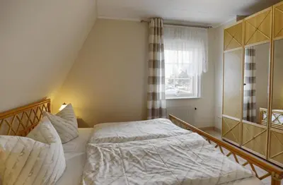 Ein Bett oder Betten in einem Zimmer der Unterkunft Strandmöwe 1