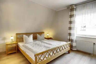 Ein Bett oder Betten in einem Zimmer der Unterkunft Strandmöwe 1