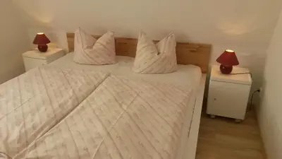 Ein Bett oder Betten in einem Zimmer der Unterkunft Strandmöwe 2
