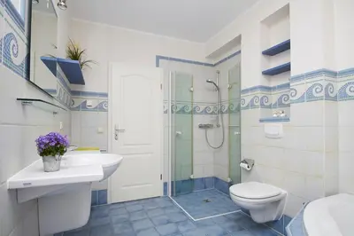 Ein Badezimmer in der Unterkunft Neue Reihe 43 Villa Regulus EG