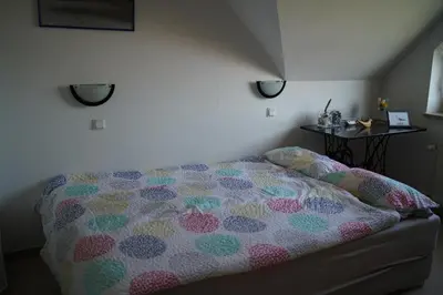 Ein Bett oder Betten in einem Zimmer der Unterkunft Strandburg