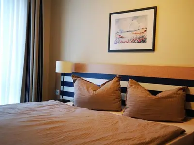 Ein Bett oder Betten in einem Zimmer der Unterkunft Am Kurhaus 508 - Ostsee-Lug, PP am Bernsteinhaus