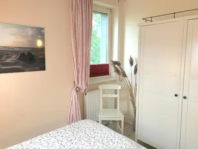 Ein Bett oder Betten in einem Zimmer der Unterkunft Ferienwohnungen im Haus Borée