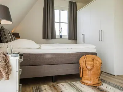 Ein Bett oder Betten in einem Zimmer der Unterkunft Luxushaus Bodstedt mit Sauna am Bodden