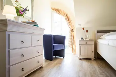 Ein Bett oder Betten in einem Zimmer der Unterkunft Luxushaus Bodden mit Schwimmbereich