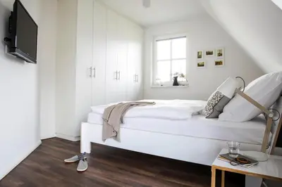 Ein Bett oder Betten in einem Zimmer der Unterkunft Luxushaus in Bodstedt mit Sauna und Lagune