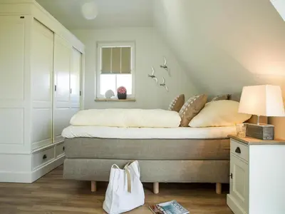 Ein Bett oder Betten in einem Zimmer der Unterkunft Luxushaus Boddenküste mit Sauna