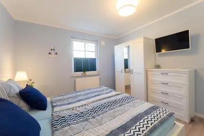 Ein Bett oder Betten in einem Zimmer der Unterkunft Möwennest 02