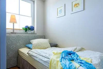 Ein Bett oder Betten in einem Zimmer der Unterkunft Gartenweg 7 Wohnung 2 3 oben links
