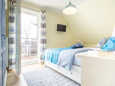 Ein Bett oder Betten in einem Zimmer der Unterkunft Ferienhaus Apfelblüte