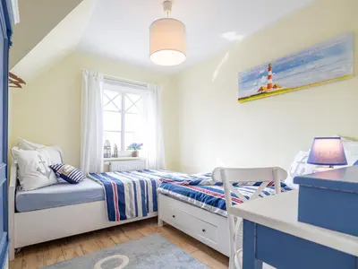 Ein Bett oder Betten in einem Zimmer der Unterkunft Ferienhaus Apfelblüte