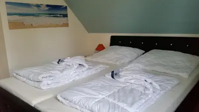 Ein Bett oder Betten in einem Zimmer der Unterkunft Ferienwohnung Strandglück