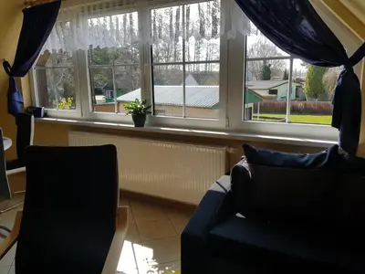 Ein Sitzbereich in der Unterkunft Ferienwohnung Strandglück