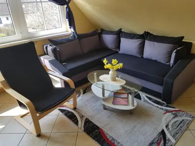 Ein Sitzbereich in der Unterkunft Ferienwohnung Strandglück