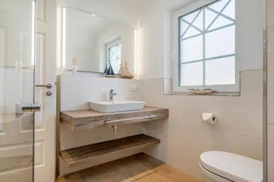 Ein Badezimmer in der Unterkunft Haus Küstenkind