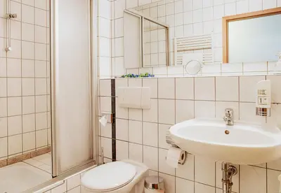 Ein Badezimmer in der Unterkunft Carmina am See