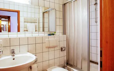 Ein Badezimmer in der Unterkunft Carmina am See