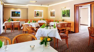 Ein Restaurant oder anderes Speiselokal in der Unterkunft Carmina am See