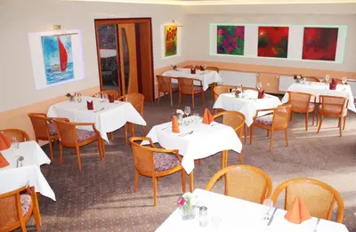 Ein Restaurant oder anderes Speiselokal in der Unterkunft Carmina am See