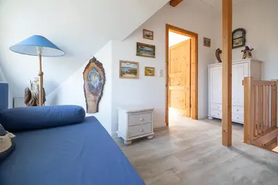 Ein Bett oder Betten in einem Zimmer der Unterkunft Ferienhaus Ginster