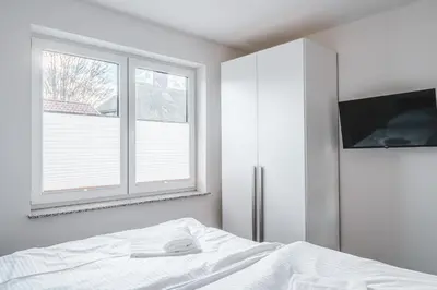 Ein Bett oder Betten in einem Zimmer der Unterkunft Dünenquartier - Apartment 01