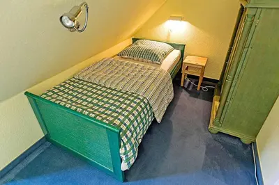 Ein Bett oder Betten in einem Zimmer der Unterkunft Ferienhaussiedlung Strandperlen Küstenhof 2c Typ V