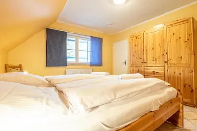 Ein Bett oder Betten in einem Zimmer der Unterkunft Ferienwohnung Glückspilz