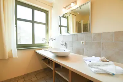 Ein Badezimmer in der Unterkunft Ferienwohnung Am Leuchtfeuer EG