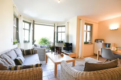 Ein Sitzbereich in der Unterkunft Ferienwohnung Am Leuchtfeuer EG